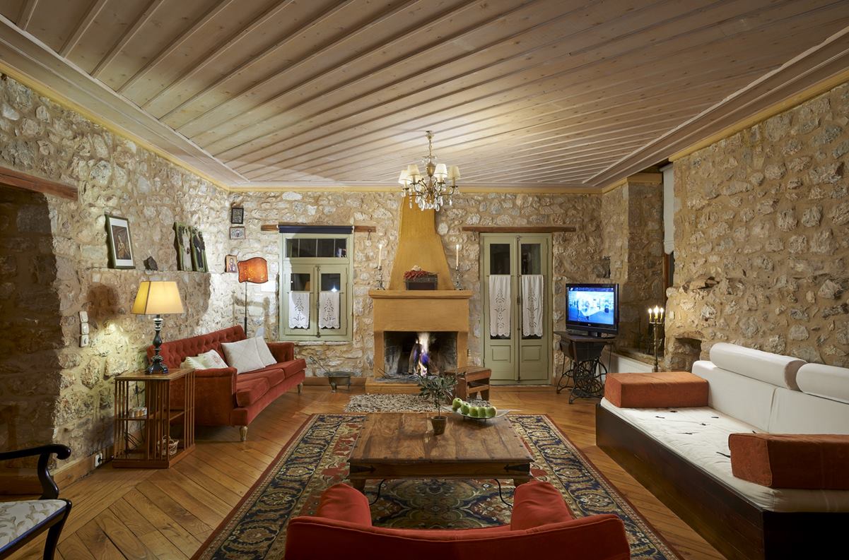 Guesthouse lounge with stone arch and fireplace