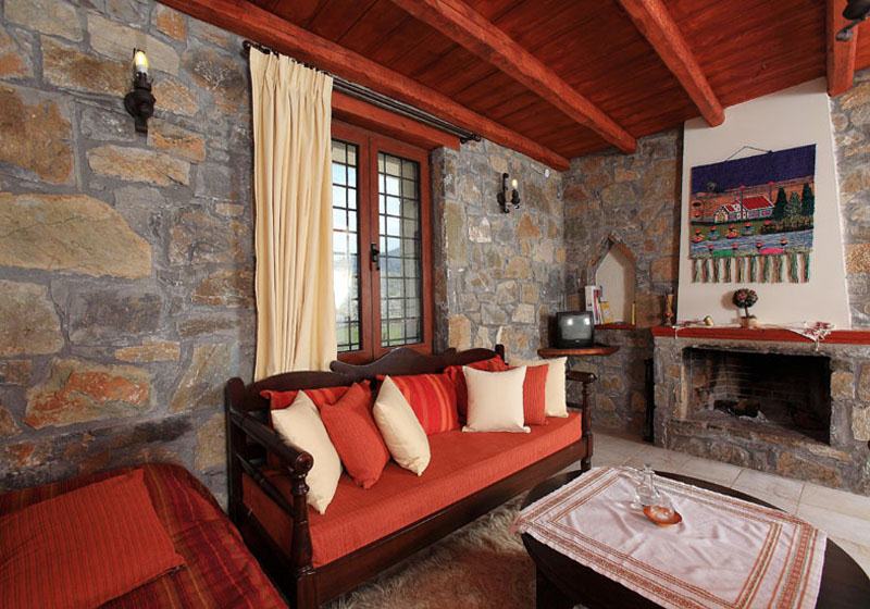 Stone interior living room with traditional fireplace